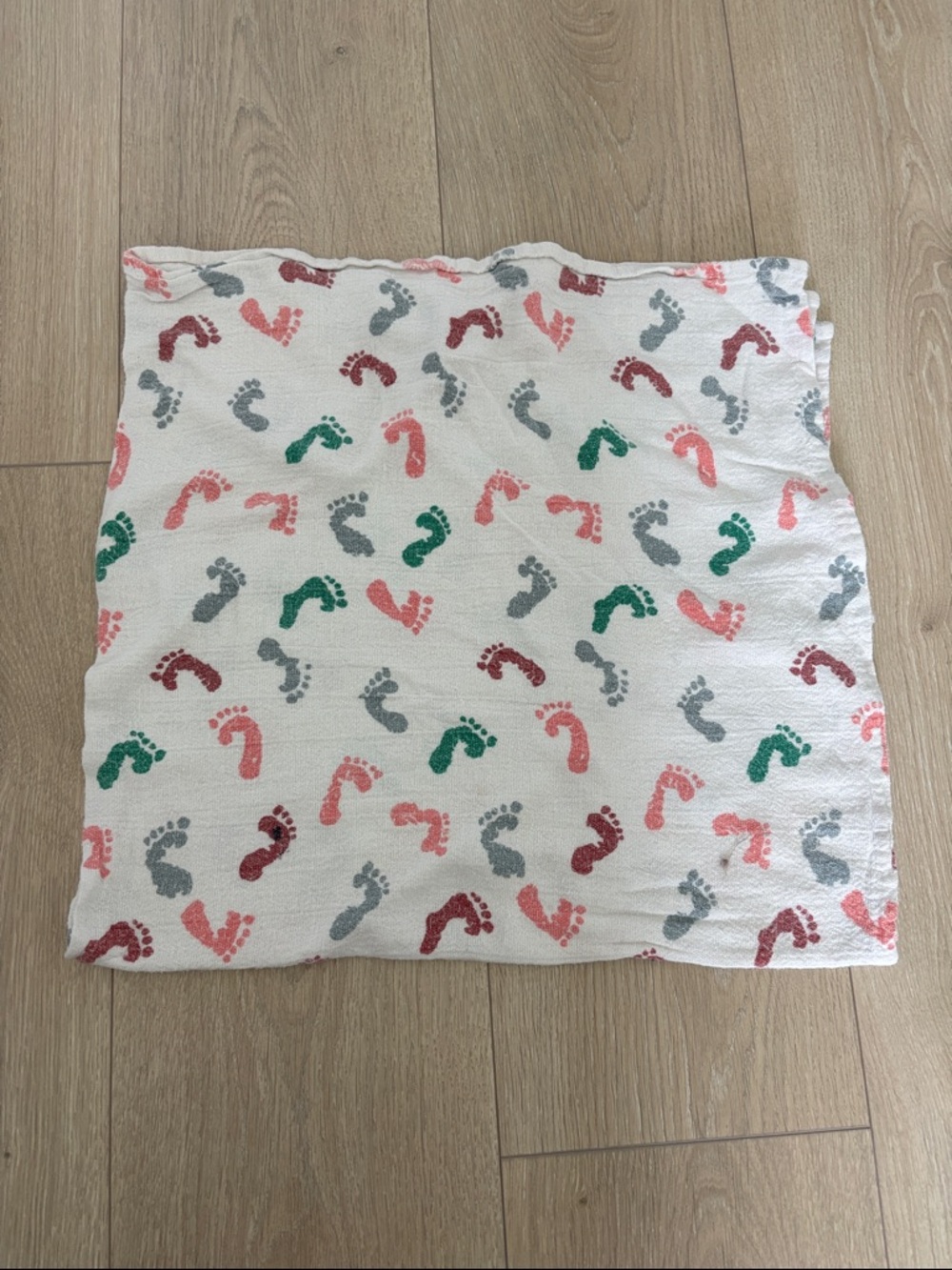 White Baby Swaddle with Pink, Green & Gray Footprint Print